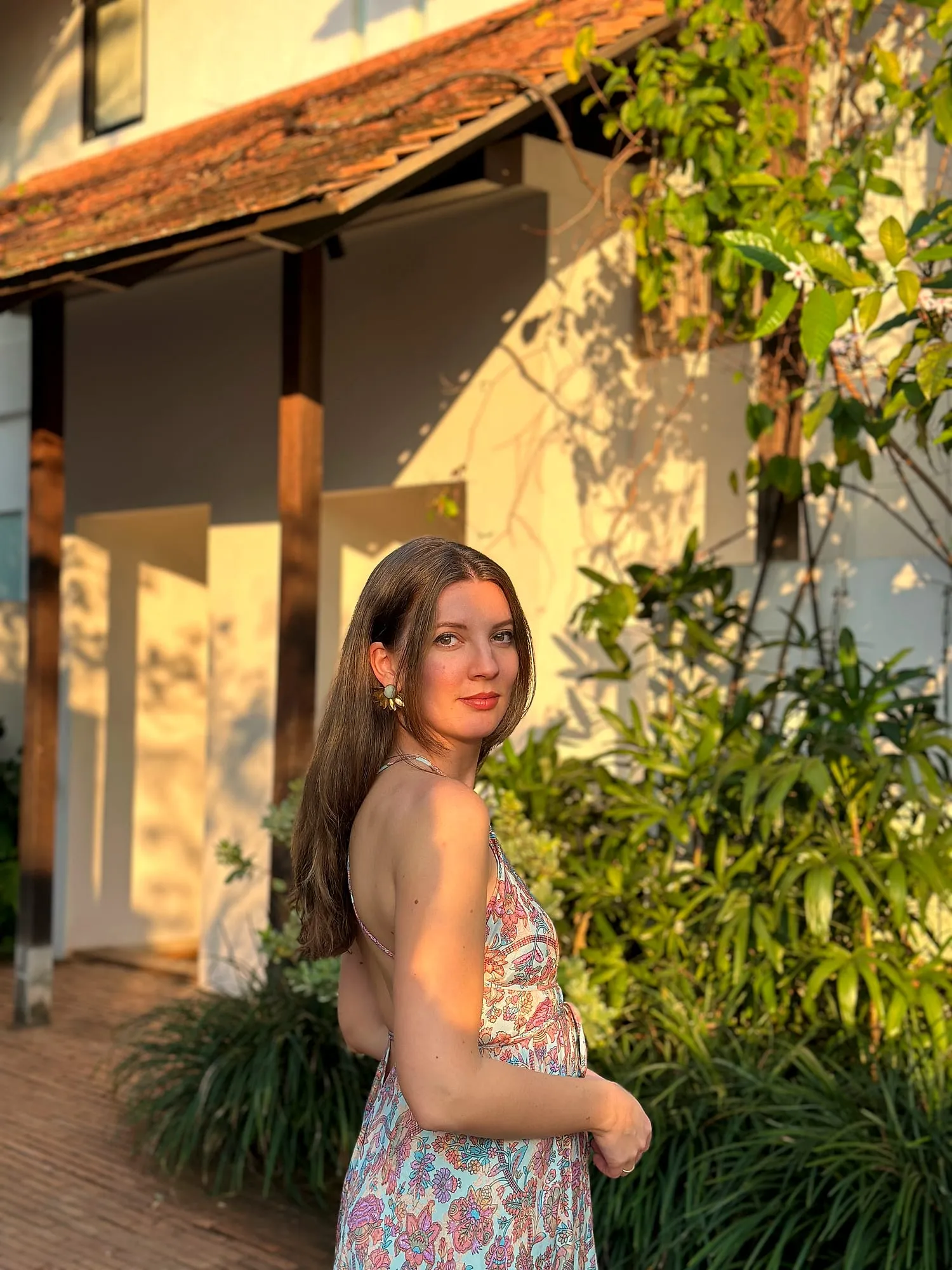Portrait of Miruna Vasi in warm evening light in the garden of Raya, Chiang Mai.